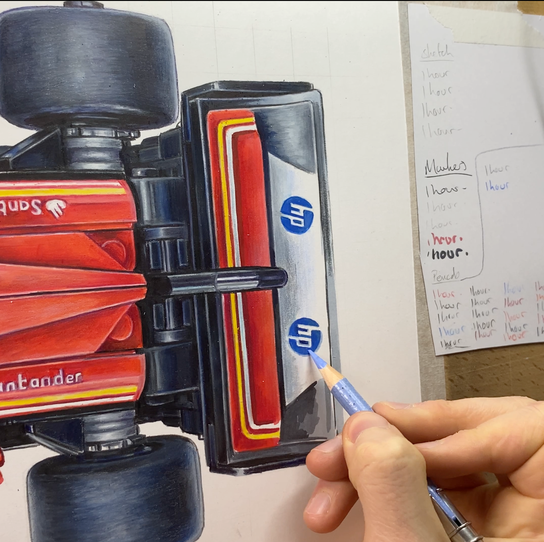 Person coloring a detailed model of a car with a pencil,
