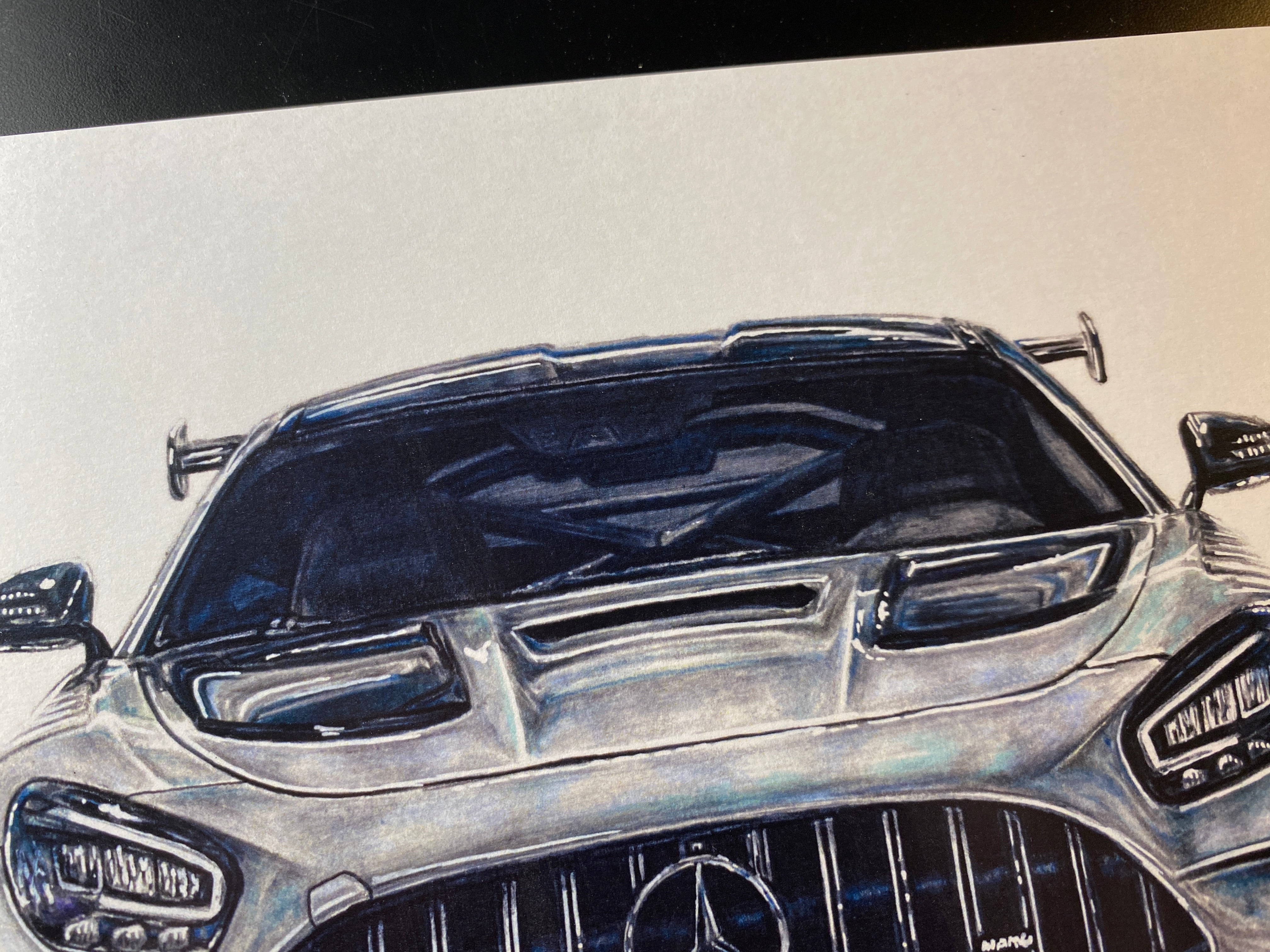 A4 limited edition art print of my realistic coloured pencil drawing of a silver Mercedes AMG GTR super car by tom mothersole