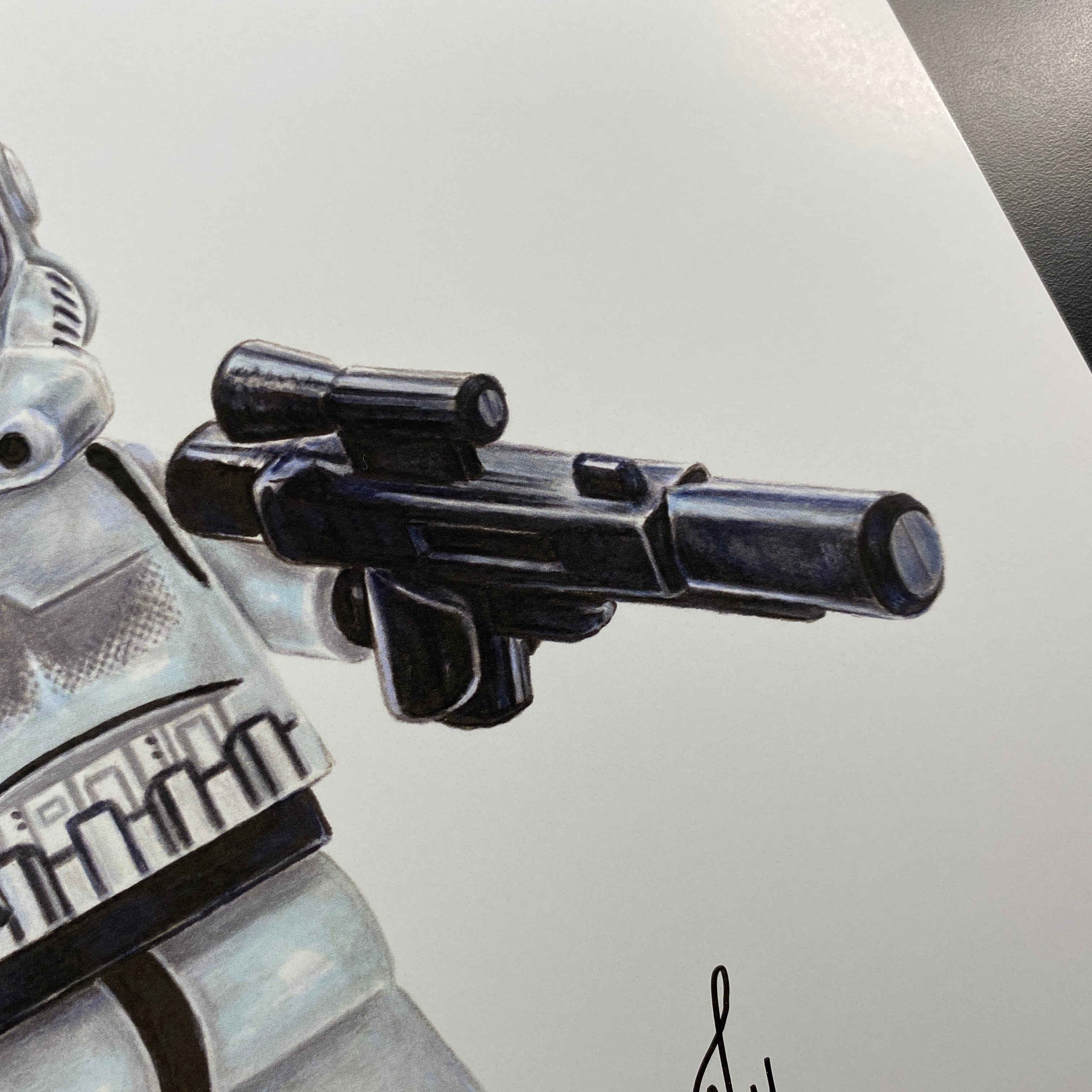 LEGO Star Wars stormtrooper drawing holding a blaster on a white background