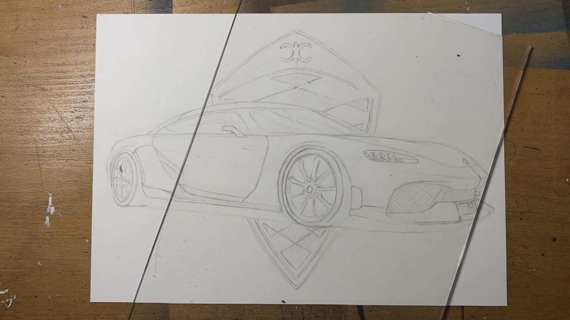 timelapse of realistic graphite pencil drawing of the Koenigsegg gemera drawn by tom mothersole