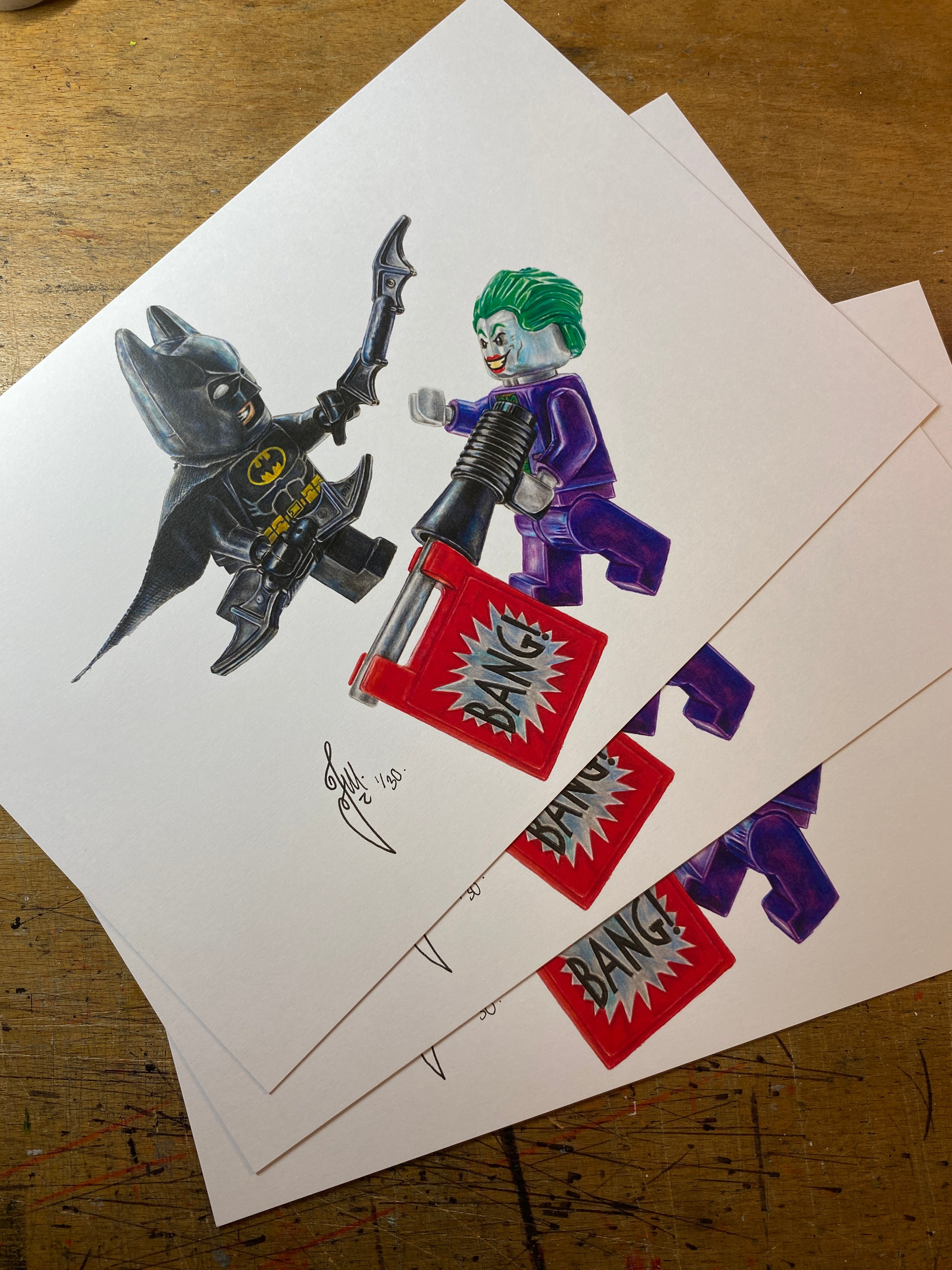 limited edition art print of my lego drawing of the LEGO Batman and Joker Minifigures drawn using coloured pencils by tom mothersole