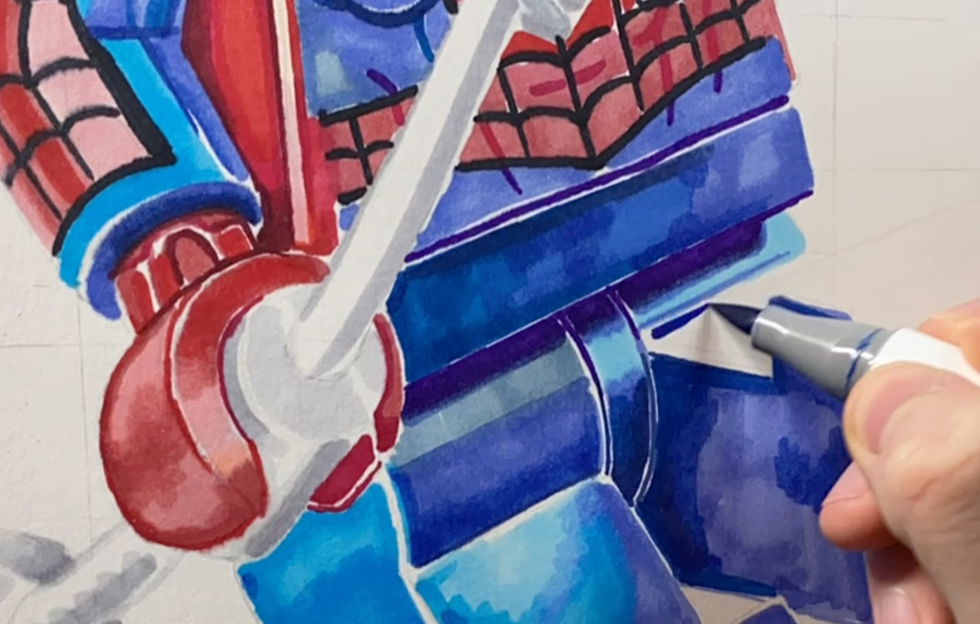 tom mothersole using alcohol markers to do a base layer of the lego spiderman minifigure